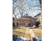 Brick home with a spacious backyard, patio, and mature trees at 536 S High St, Denver, CO 80209