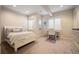 Cozy bedroom featuring plush carpet, bright windows, and a charming desk area with plenty of natural light at 2117 S Juniper St, Lakewood, CO 80228