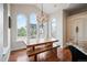 Inviting breakfast nook featuring a wooden table, bench seating, and scenic views at 2117 S Juniper St, Lakewood, CO 80228