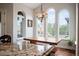 Bright breakfast nook with a modern table and chairs, large windows with backyard views at 2117 S Juniper St, Lakewood, CO 80228