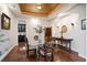 Elegant dining room with hardwood floors, custom lighting, and adjacent butler's pantry at 2117 S Juniper St, Lakewood, CO 80228