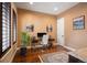 Comfortable home office with natural light, wood floors, and a stylish desk setup for productivity at 2117 S Juniper St, Lakewood, CO 80228