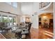 Bright living room with high ceilings, modern decor, and access to the outdoor patio at 2117 S Juniper St, Lakewood, CO 80228