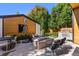 Inviting backyard featuring a fire pit, outdoor seating, and a built-in grill perfect for entertaining at 619 S High St, Denver, CO 80209