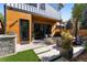 Backyard patio featuring a fire pit, grill, and outdoor seating with a view of the home's modern exterior at 619 S High St, Denver, CO 80209