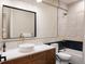 Bright bathroom featuring modern fixtures, a sink, and a shower over tub at 619 S High St, Denver, CO 80209
