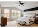 Spacious main bedroom features a tray ceiling, shiplap accent wall, and dual windows at 619 S High St, Denver, CO 80209