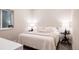 Comfortable bedroom featuring a bed with side tables and lamps and a large window at 619 S High St, Denver, CO 80209