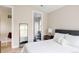 Bedroom showcasing a modern design with access to a bathroom and filled with natural light at 619 S High St, Denver, CO 80209
