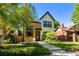 Charming two-story home featuring modern wood and brick accents with a well-manicured front yard at 619 S High St, Denver, CO 80209