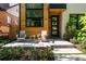 Inviting front porch featuring comfortable seating, stylish decor, and a view of the home's modern design at 619 S High St, Denver, CO 80209