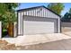 Spacious detached two-car garage with a white door and plenty of room for parking and storage at 619 S High St, Denver, CO 80209