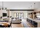 Spacious open-concept living space featuring a modern kitchen with large island and a cozy living area at 619 S High St, Denver, CO 80209