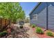 A charming backyard featuring a trampoline, fire pit, and low-maintenance rock and mulch landscaping at 2670 E 136Th Pl, Thornton, CO 80602