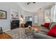 Inviting living room with a fireplace, hardwood floors, and stylish furnishings at 2670 E 136Th Pl, Thornton, CO 80602