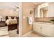 Charming bathroom with white cabinets, granite countertops, and neutral-toned walls at 8588 S Woody Way, Highlands Ranch, CO 80126