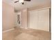 Spacious bedroom with closet, doorway to bathroom, and neutral walls at 8588 S Woody Way, Highlands Ranch, CO 80126