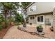 Beautiful home exterior showcasing a well-manicured yard, patio and inviting ambiance at 8588 S Woody Way, Highlands Ranch, CO 80126
