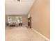 Spacious living room with cozy fireplace, neutral paint, and natural light streaming through the windows at 8588 S Woody Way, Highlands Ranch, CO 80126