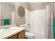 Standard bathroom featuring a shower-tub combo with decorative curtain and hardware, and wood vanity with a white sink at 3596 S Jebel Cir, Aurora, CO 80013