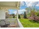 Back porch with an outdoor seating area and view of the manicured backyard at 474 W Spruce St, Louisville, CO 80027