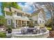 Spacious backyard featuring a stone fire pit with chairs and manicured lawn at 474 W Spruce St, Louisville, CO 80027