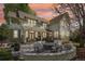 Inviting backyard patio with stone fire pit and outdoor seating, perfect for entertaining and relaxing at 474 W Spruce St, Louisville, CO 80027