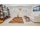 Basement featuring shelving, furniture, rug, and a flat screen television at 474 W Spruce St, Louisville, CO 80027