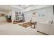 Large, carpeted basement area with furniture, shelving and decor at 474 W Spruce St, Louisville, CO 80027