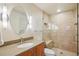 Bathroom featuring a glass shower with built in seating, and modern lighting fixtures at 474 W Spruce St, Louisville, CO 80027