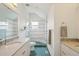 Modern bathroom with glass-enclosed shower and double sink vanity at 474 W Spruce St, Louisville, CO 80027