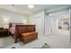 Bedroom with wood furnishings, light blue walls and carpet, and walk-through entry at 474 W Spruce St, Louisville, CO 80027