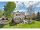 Exterior view of home showcasing backyard with patio, fire pit, and grill at 474 W Spruce St, Louisville, CO 80027