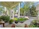 Inviting front porch showcasing views of birch trees and lush landscaping at 474 W Spruce St, Louisville, CO 80027