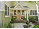 Charming front porch with rocking chair and potted plants, creating a welcoming entrance at 474 W Spruce St, Louisville, CO 80027