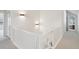 Upstairs hallway with white banister and doors, leading to bedrooms at 474 W Spruce St, Louisville, CO 80027