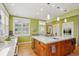 Bright kitchen boasts stainless appliances, a center island with seating, and lots of natural light at 474 W Spruce St, Louisville, CO 80027