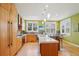 Bright kitchen boasts stainless appliances, center island with bar seating, and an abundance of cabinet space at 474 W Spruce St, Louisville, CO 80027