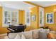 Bright living room featuring a piano and large windows that let in natural light at 474 W Spruce St, Louisville, CO 80027