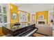 Bright living room featuring a piano, fireplace and large windows that let in natural light at 474 W Spruce St, Louisville, CO 80027