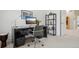 Home office with a modern desk, comfortable chair, and stylish shelving unit at 474 W Spruce St, Louisville, CO 80027