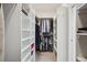 Spacious walk-in closet featuring ample storage and shelving at 474 W Spruce St, Louisville, CO 80027
