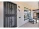 Inviting front entrance featuring security door, house number, and a cozy chair near the large window at 1380 S Fillmore St, Denver, CO 80210