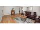 Cozy living room with hardwood floors, dark leather couch, and a stylish coffee table at 1380 S Fillmore St, Denver, CO 80210