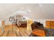 Bright bedroom featuring hardwood floors, natural light, and comfortable furnishings and decor, providing ample space at 9061 N Rex Ln, Conifer, CO 80433