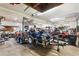 Spacious garage interior filled with vehicles, tools, and a trailer under bright lighting at 9061 N Rex Ln, Conifer, CO 80433