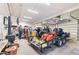 Bright garage interior showcasing multiple motorcycles on a trailer and various tools at 9061 N Rex Ln, Conifer, CO 80433