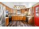 Well-lit kitchen features wooden cabinets, modern appliances, and a stylish backsplash at 9061 N Rex Ln, Conifer, CO 80433