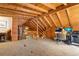 Open-concept living room with beamed ceilings, with a loft-like feel that's perfect for entertaining or relaxing at 9061 N Rex Ln, Conifer, CO 80433