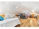 Bright living room with hardwood floors and vaulted ceilings, and an open layout creating a comfortable and inviting living space at 9061 N Rex Ln, Conifer, CO 80433